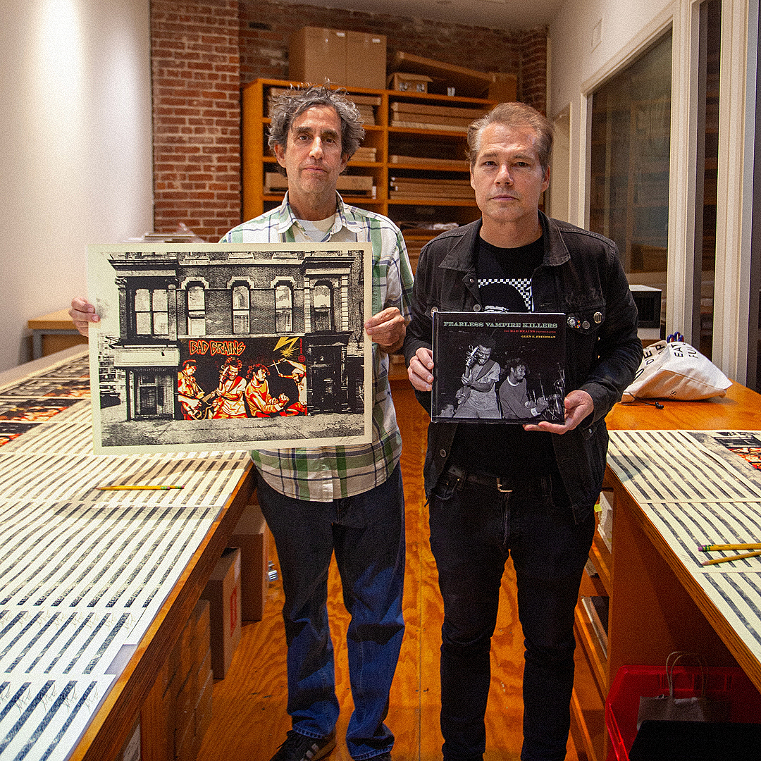 Two men, Shepard Fairey and Glen E. Friedman, holding a