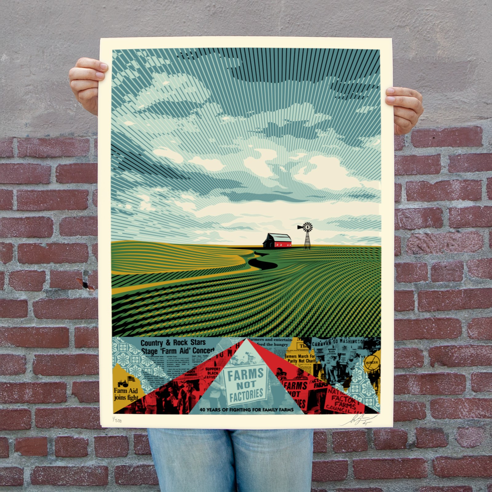 A person holds a poster of a green field with a red barn and windmill under a striped sky. Below, a collage of newspaper…