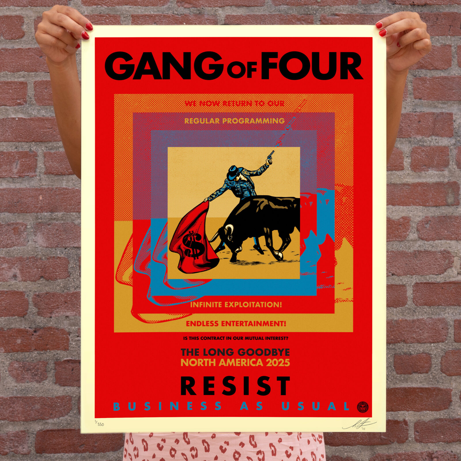 A person holds a red, yellow, and blue poster for "GANG of FOUR" with a bullfighter and bull, and text: "WE NOW RETURN TO…