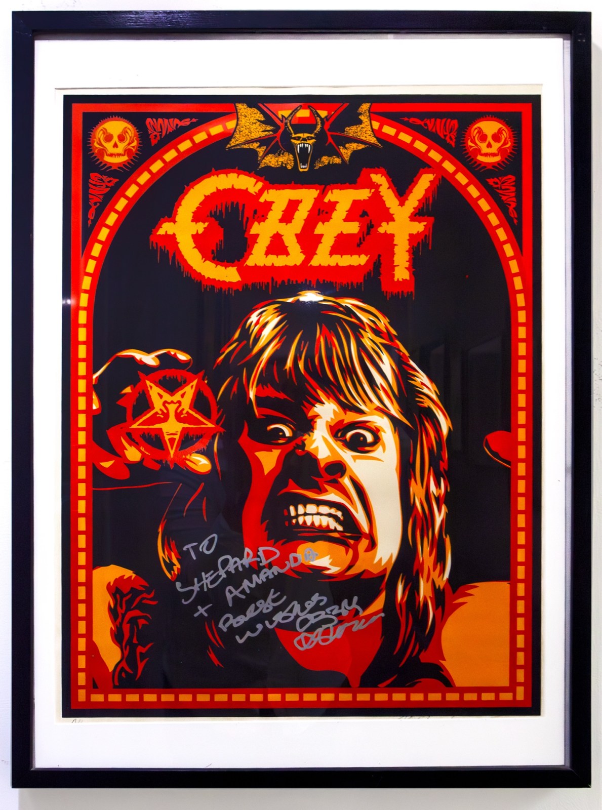 Framed Ozzy Osbourne poster with signatures: To Shepard + Amanda, Robert, wishes Ozzy.